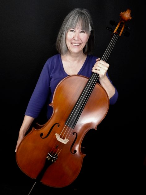 woman holding cello